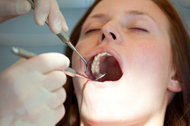 Woman getting a professional dental cleaning